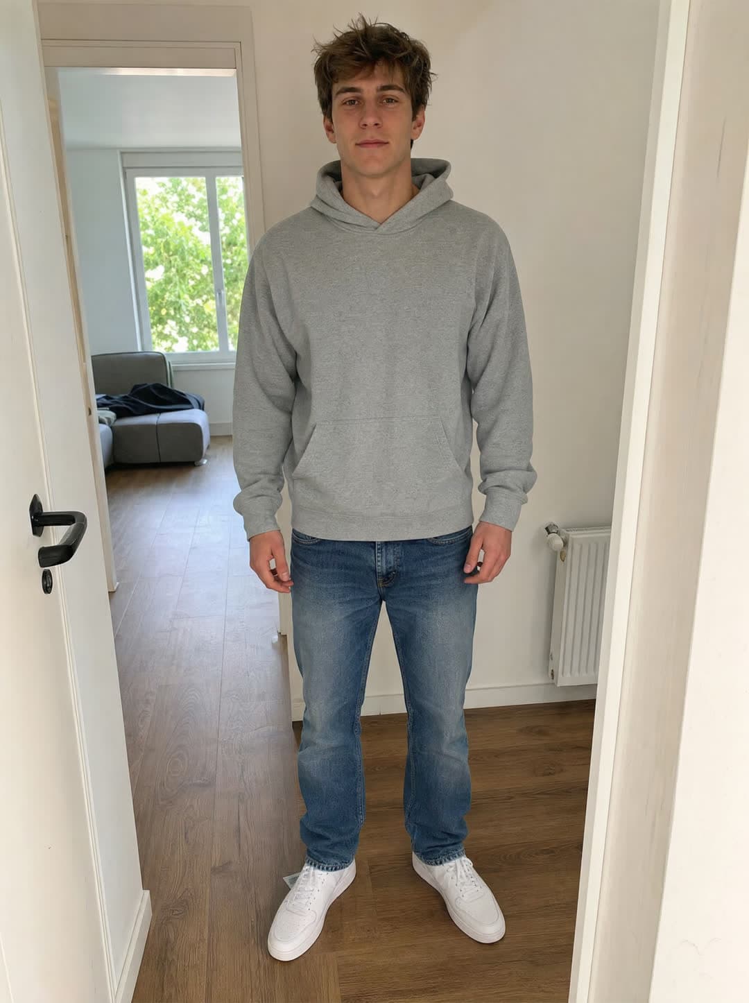 A person in a grey hoodie